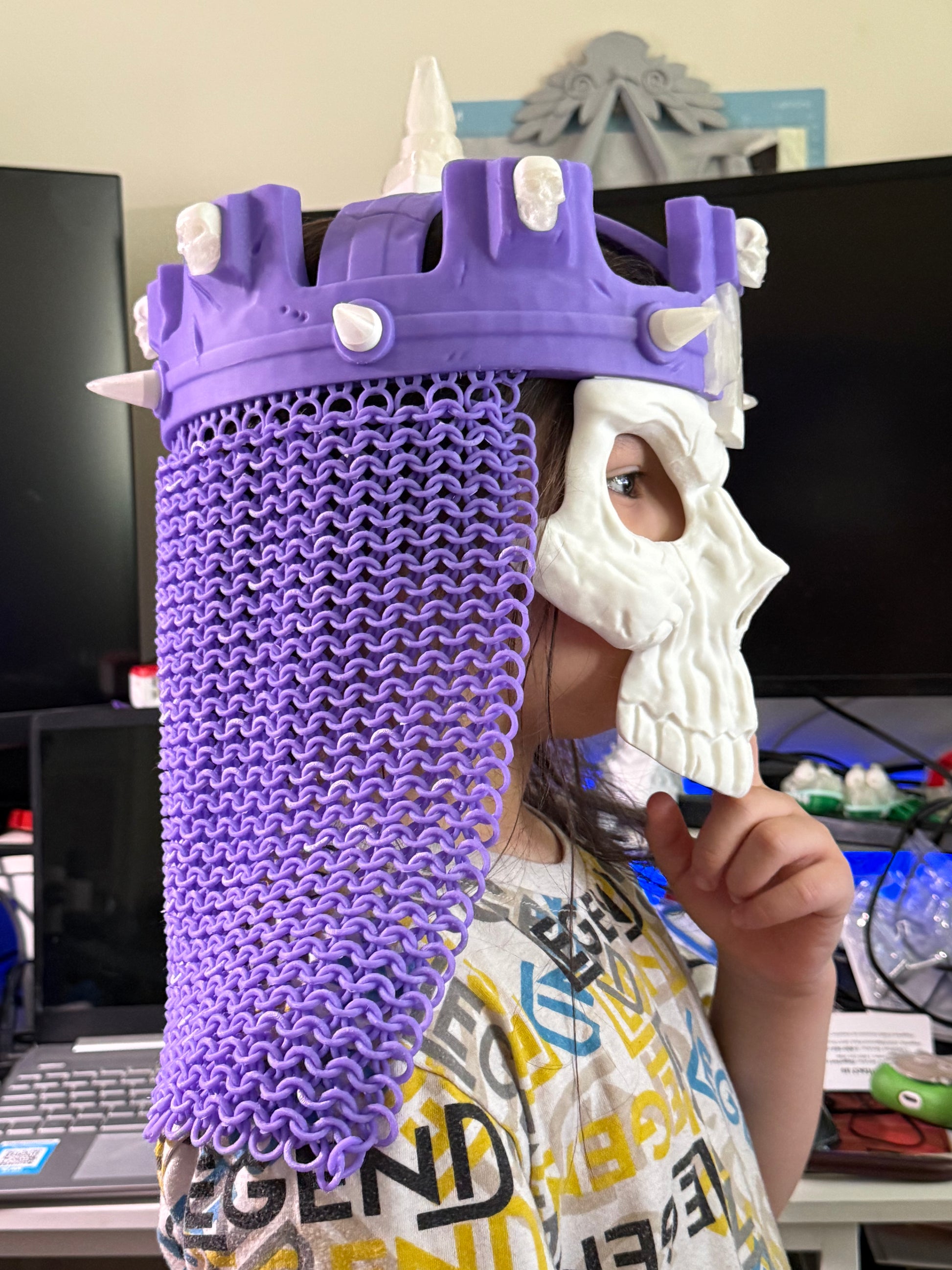 Side view of the purple 3D printed WWE Skull King Crown with spiked details, chainmail-style drape, and skull mask.
