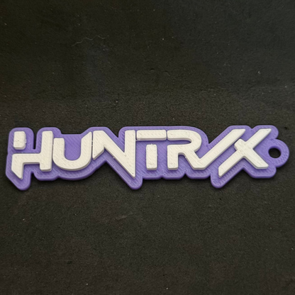 HUNTRIX logo patch on a black background