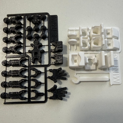Black and white plastic parts on a gray background