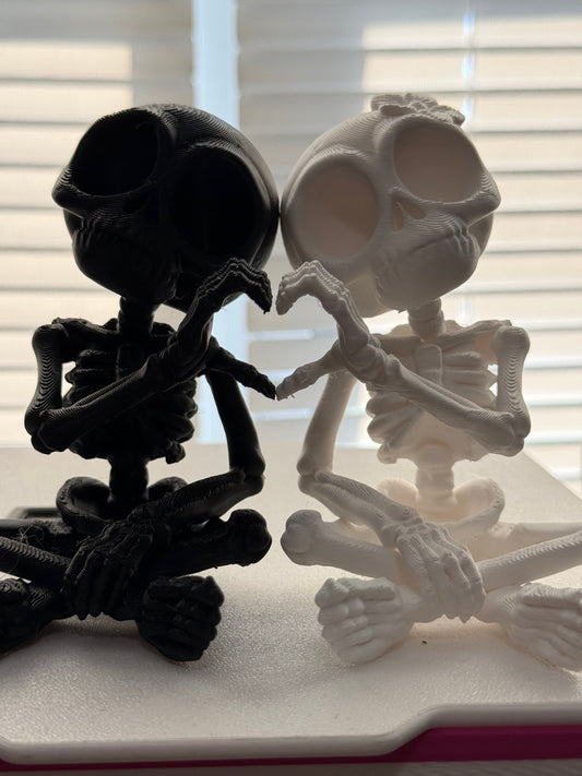 Skeleton heart-hands pair, black and white 3D printed figures