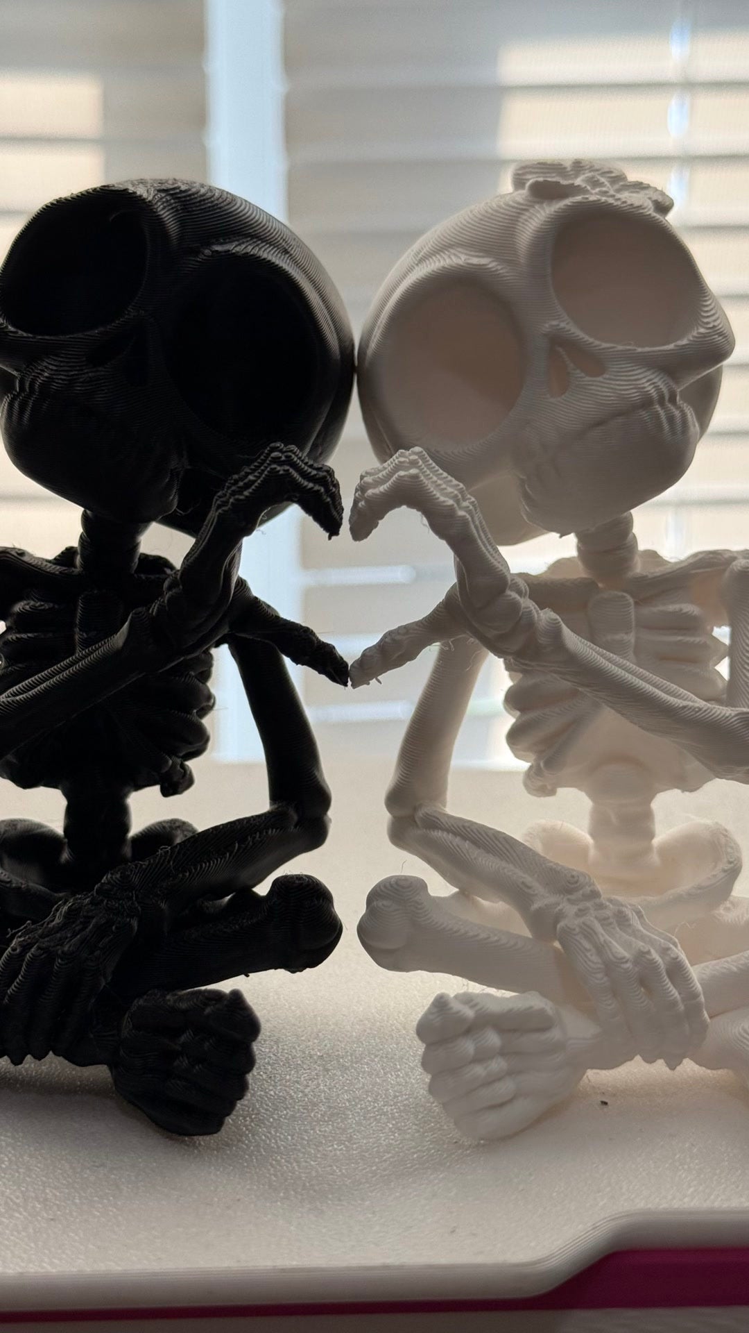 Skeleton heart-hands pair reel cover